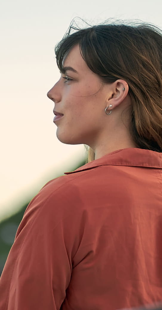 lady looking at sunset crop