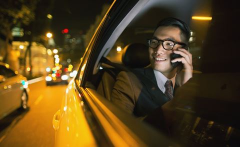 banner-Man-with-phone-inside-a-car