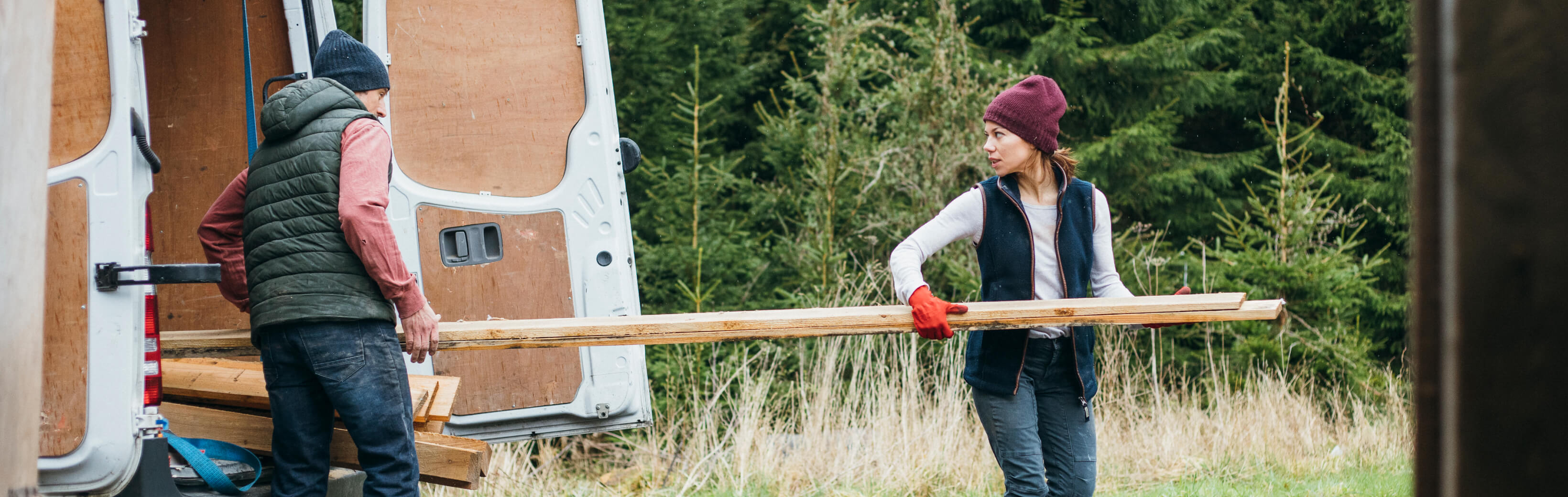 Hero-lady-carrying-wood-out-lcv